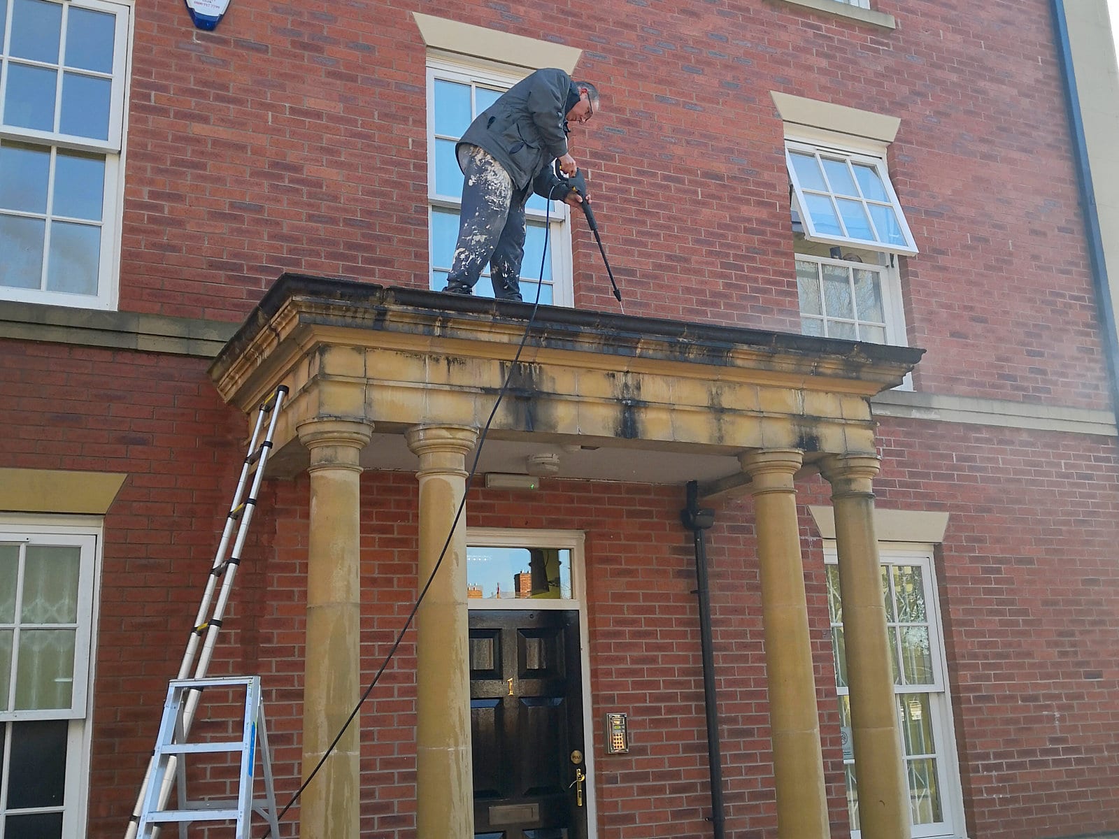 External stone work being cleaned